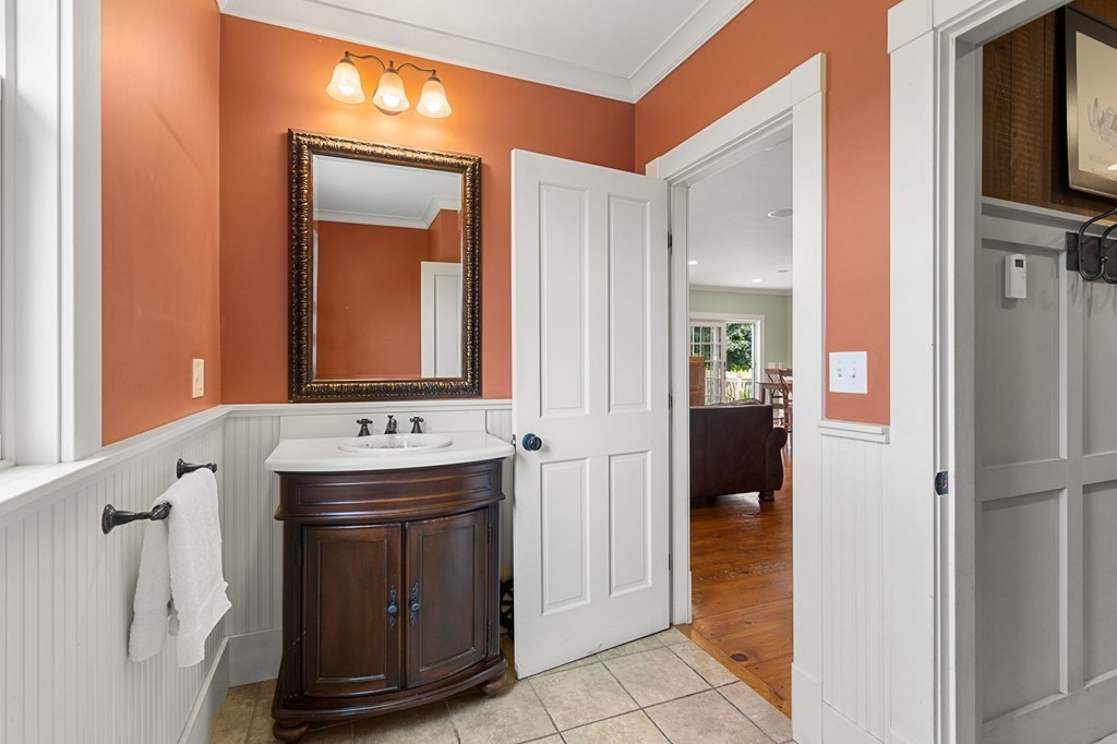 44 Old Ayer Road Groton, MA 01450 - Photo 16 of 41 a bathroom with a sink and a mirror