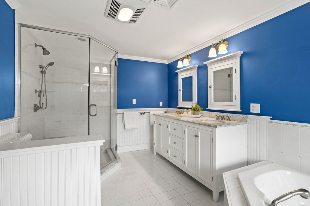 44 Old Ayer Road Groton, MA 01450 - Photo 19 of 41 a bathroom with a granite countertop double vanity sink mirror and shower