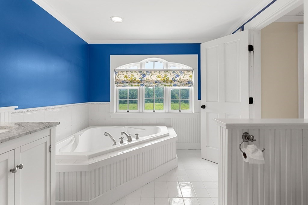 44 Old Ayer Road Groton, MA 01450 - Photo 20 of 41 a bathroom with a bathtub and a shower