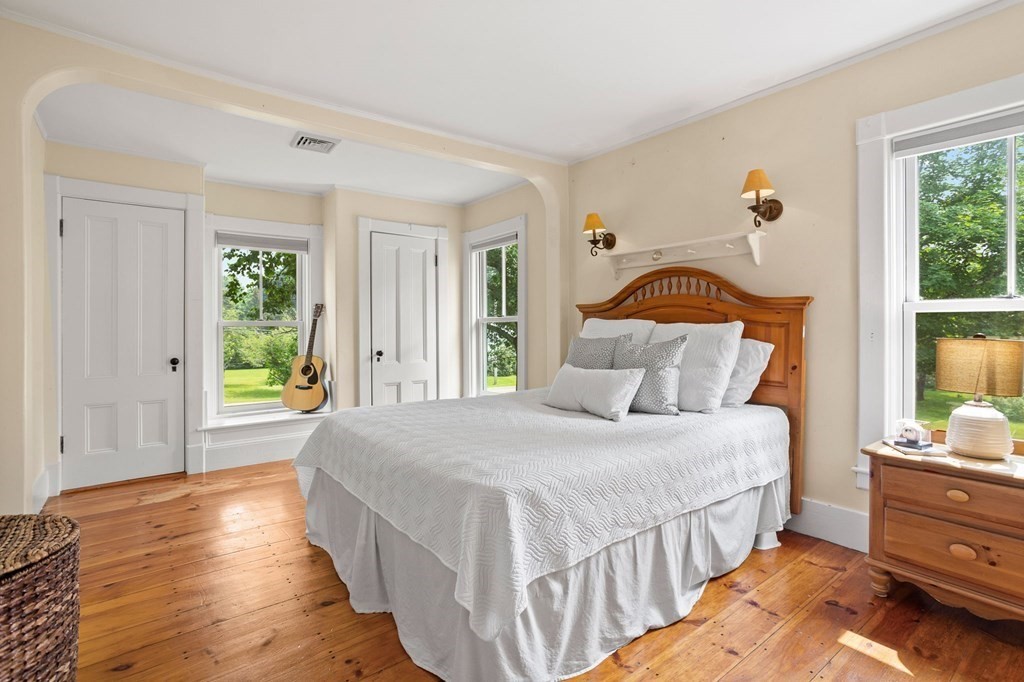 44 Old Ayer Road Groton, MA 01450 - Photo 21 of 41 a bedroom with a bed and a window
