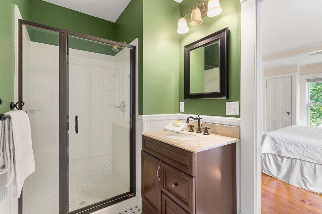 44 Old Ayer Road Groton, MA 01450 - Photo 22 of 41 a bathroom with a sink and a mirror