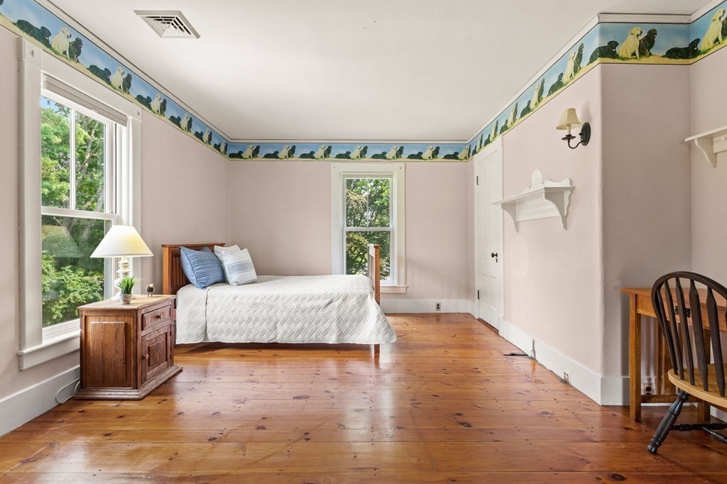 44 Old Ayer Road Groton, MA 01450 - Photo 23 of 41 a spacious bedroom with a bed and a large window