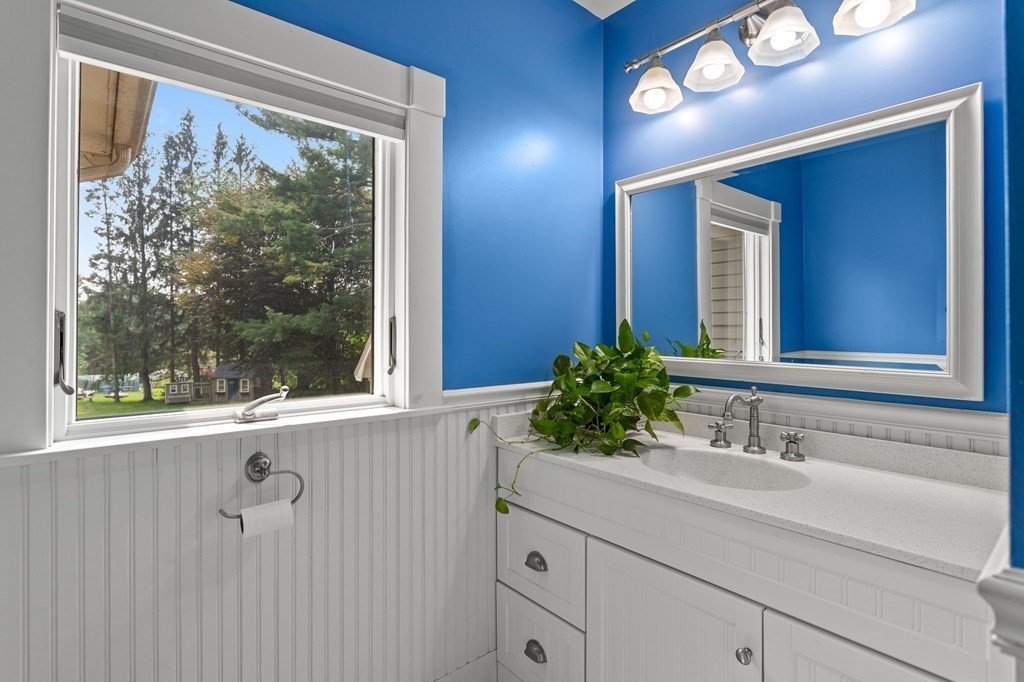 44 Old Ayer Road Groton, MA 01450 - Photo 26 of 41 a bathroom with a sink and a mirror