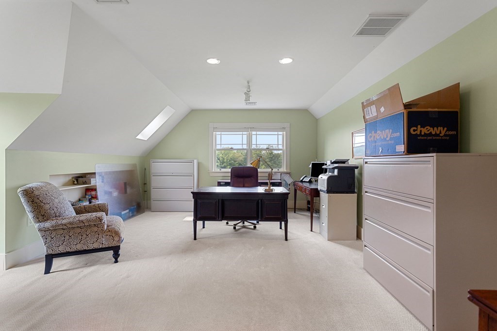 44 Old Ayer Road Groton, MA 01450 - Photo 29 of 41 a living room with furniture and a flat screen tv
