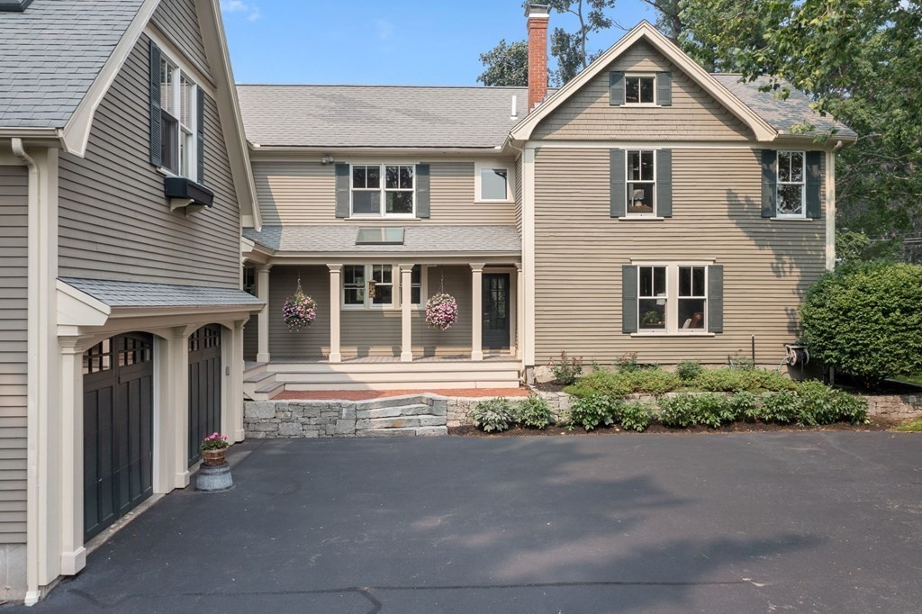 44 Old Ayer Road Groton, MA 01450 - Photo 33 of 41 a front view of a house with a yard and garage