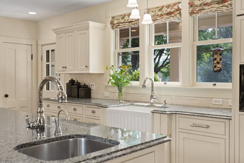 44 Old Ayer Road Groton, MA 01450 - Photo 8 of 41 a kitchen with granite countertop a sink stainless steel appliances and cabinets