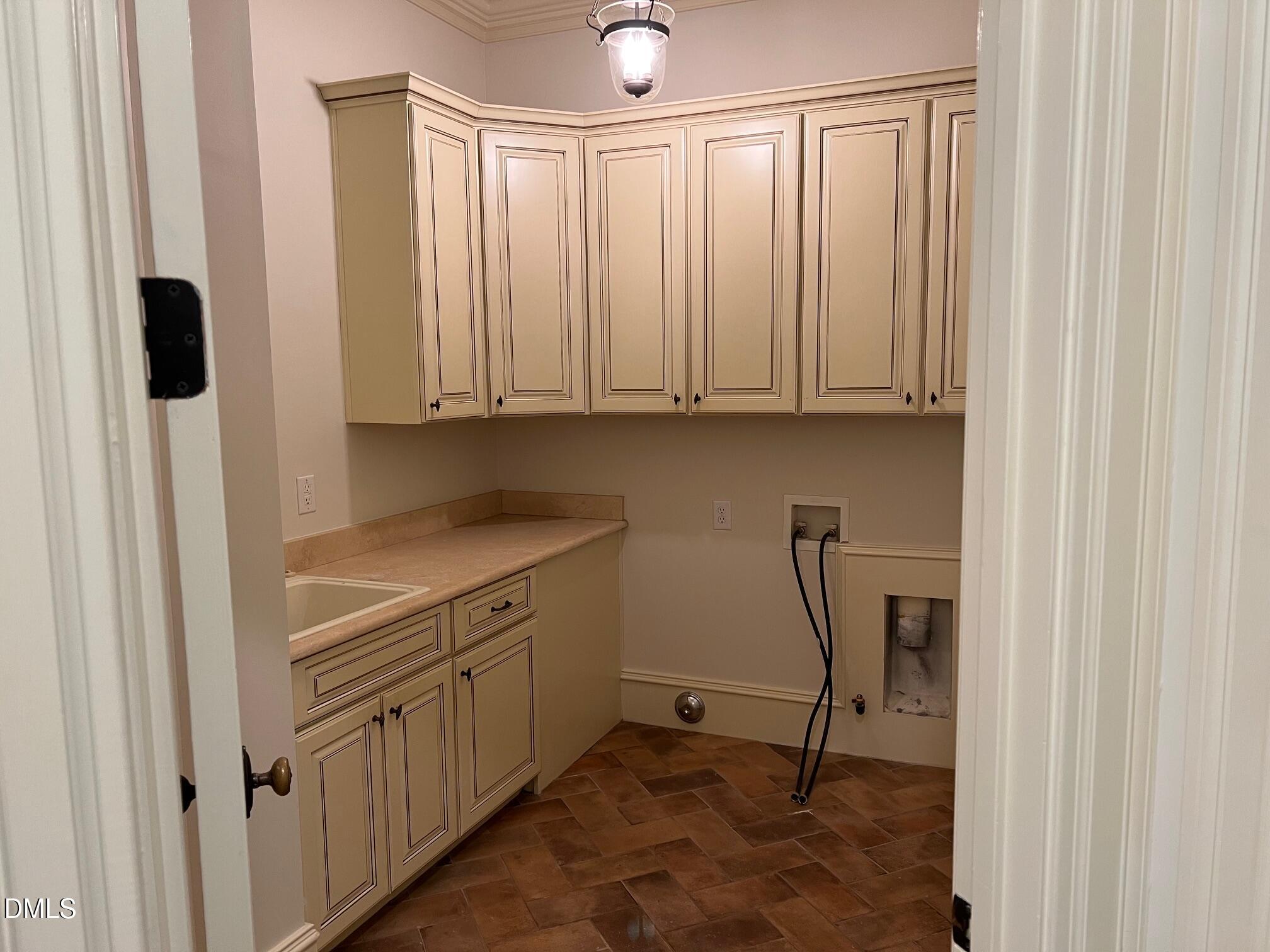 3316 Darien Drive Raleigh, NC 27607 - Photo 16 of 30 a kitchen with white cabinets and sink