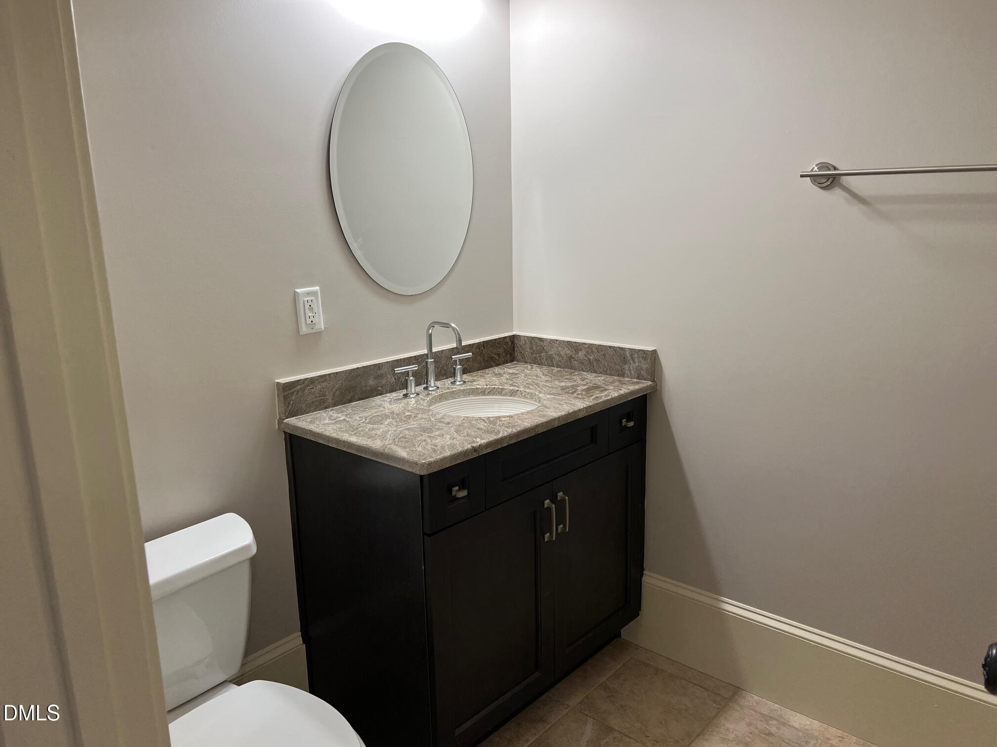 3316 Darien Drive Raleigh, NC 27607 - Photo 26 of 30 a bathroom with a sink and a mirror