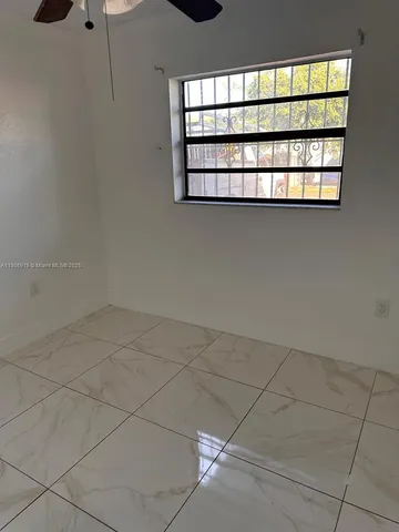 a close up of a wall with a window