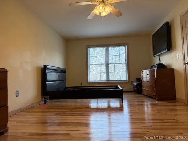 a living room with furniture window and flat screen tv
