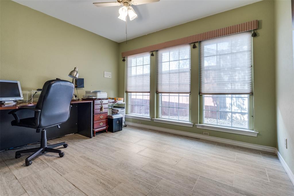 7115 Duffield Drive Dallas, TX 75248 - Photo 12 of 25 a view of a workspace with furniture and a window
