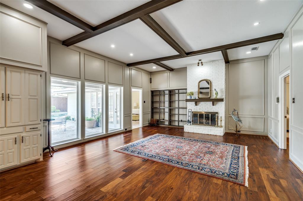 7115 Duffield Drive Dallas, TX 75248 - Photo 13 of 25 a large hall with the floor to ceiling window and wooden floor