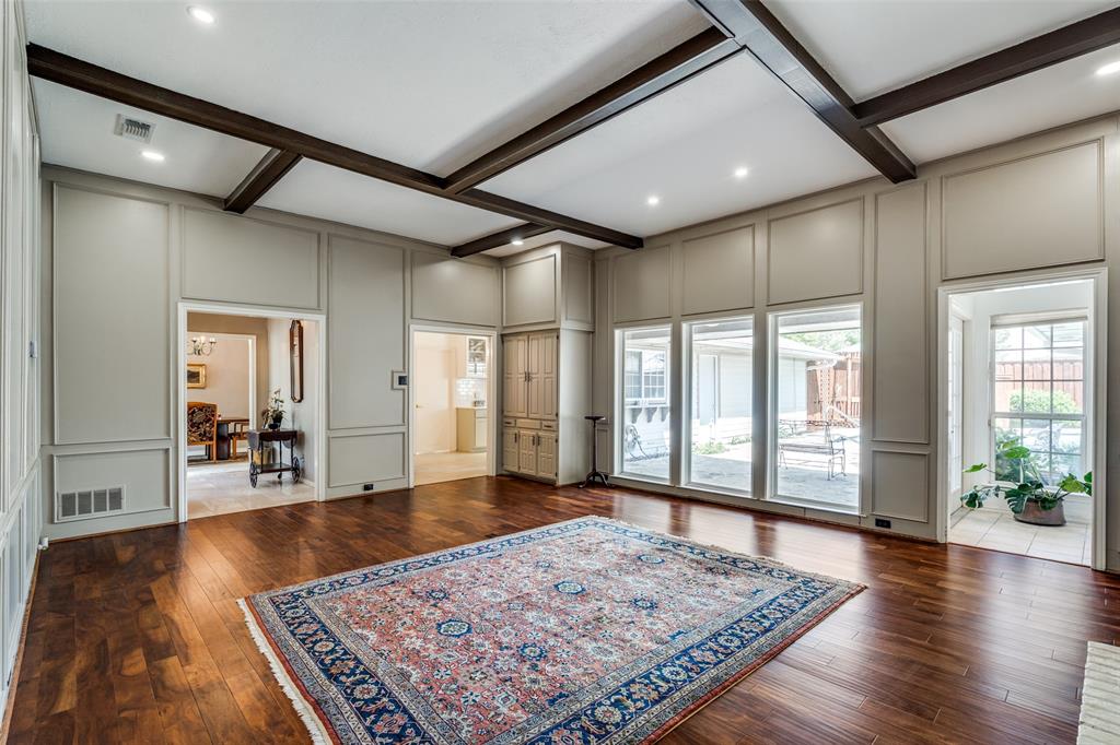 7115 Duffield Drive Dallas, TX 75248 - Photo 14 of 25 a living room with hardwood floor and a rug