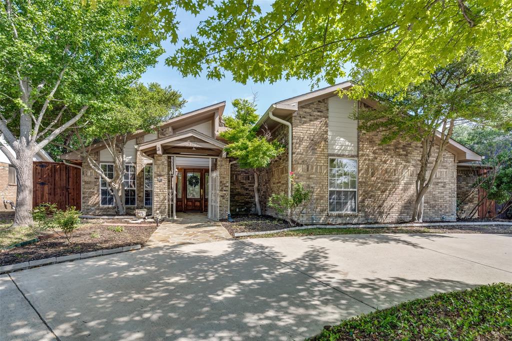 7115 Duffield Drive Dallas, TX 75248 - Photo 2 of 25 a front view of a house with a yard