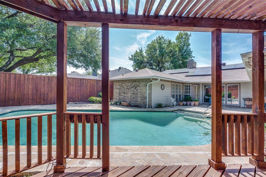 7115 Duffield Drive Dallas, TX 75248 - Photo 24 of 25 a view of a house with backyard and porch