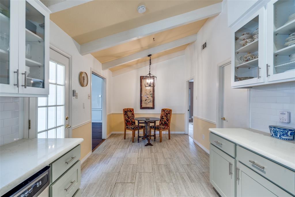 7115 Duffield Drive Dallas, TX 75248 - Photo 9 of 25 a view of a dining room with furniture and wooden floor