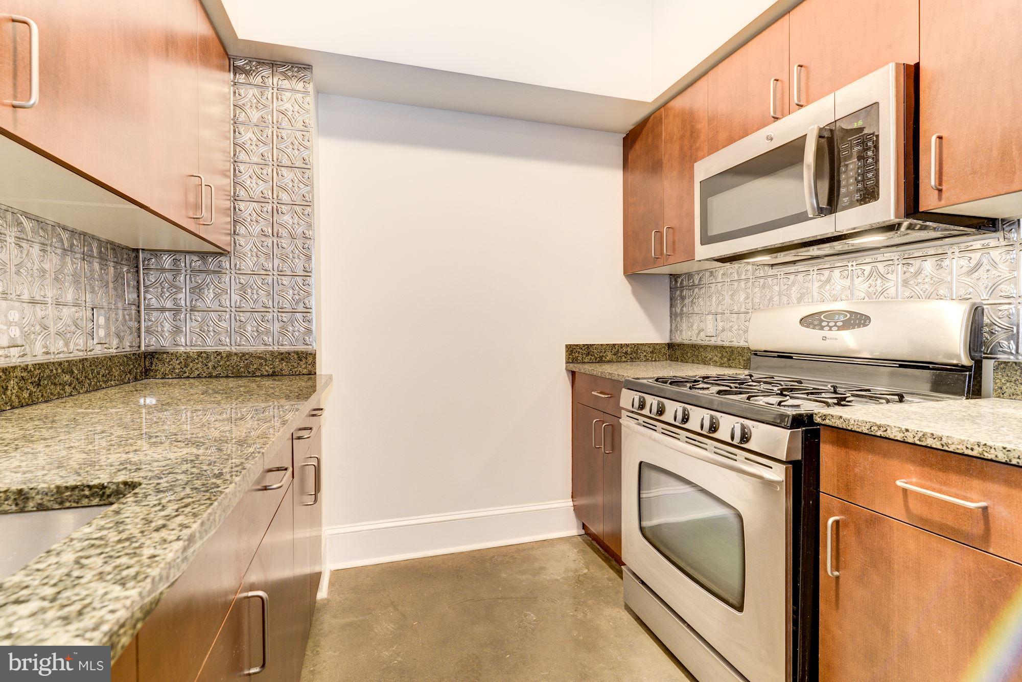 1000 New Jersey Avenue Southeast, Unit 1115 Washington, DC 20003 - Photo 6 of 25 Kitchen with Stainless Appliances and Granite