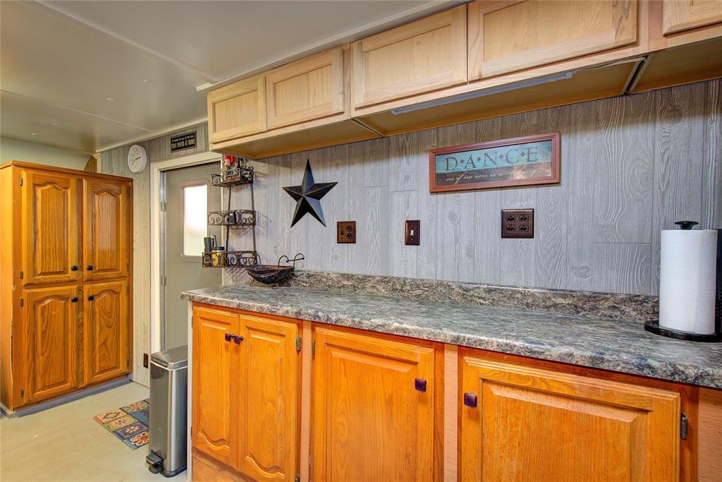 8 Lots Prairie Yantis, TX 75497 - Photo 11 of 24 a kitchen with stainless steel appliances granite countertop a sink and cabinets