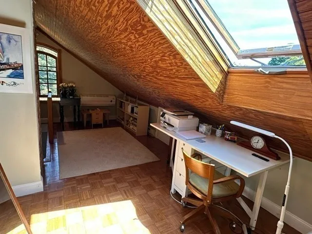 a kitchen with a table chairs refrigerator and cabinets