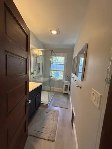 a kitchen with a table chairs stove and cabinets