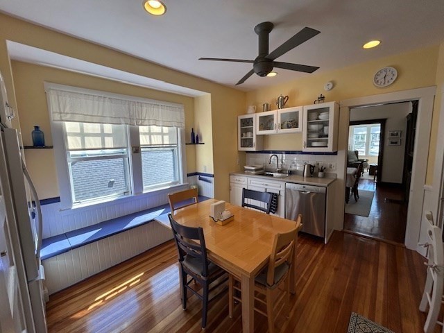 274 Poplar Street, Unit 3 Boston, MA 02131 - Photo 14 of 25 a kitchen with a table chairs refrigerator and cabinets
