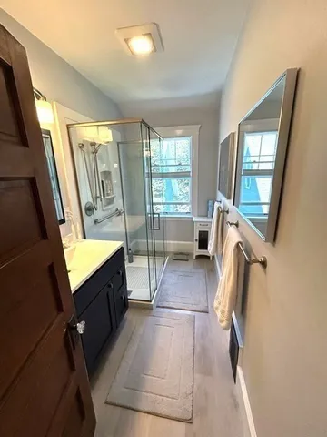 a bathroom with a sink a toilet and mirror