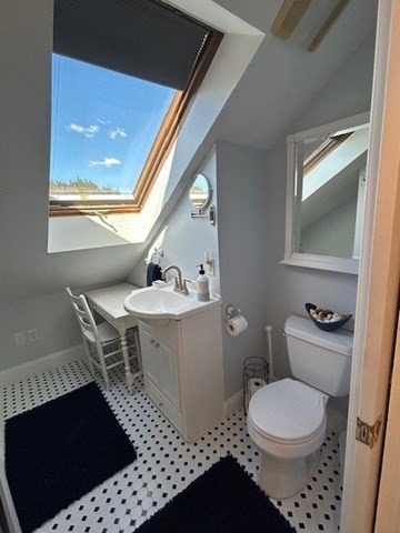 274 Poplar Street, Unit 3 Boston, MA 02131 - Photo 22 of 25 a bathroom with a sink a toilet and mirror