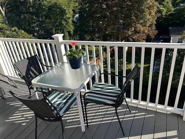 274 Poplar Street, Unit 3 Boston, MA 02131 - Photo 23 of 25 a view of a chairs and table in the roof deck
