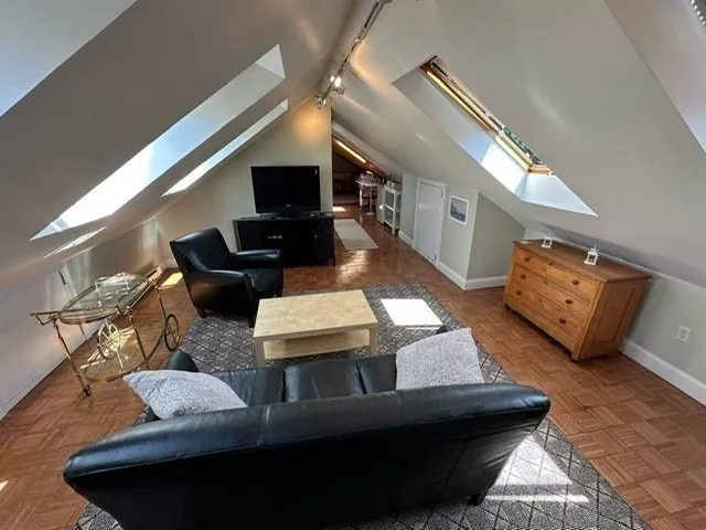 a view of a hallway with seating space