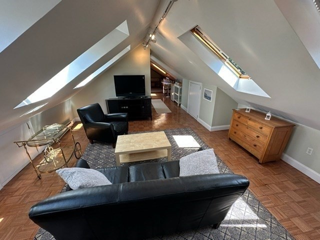 274 Poplar Street, Unit 3 Boston, MA 02131 - Photo 9 of 25 a living room with furniture and a fireplace