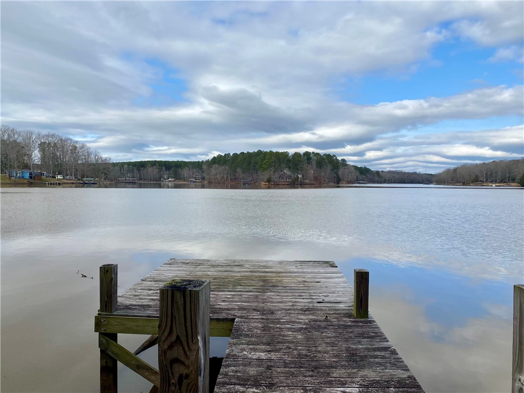 This tranquil waterfront setting offers direct access to expansive lake views and peaceful natural surroundings.