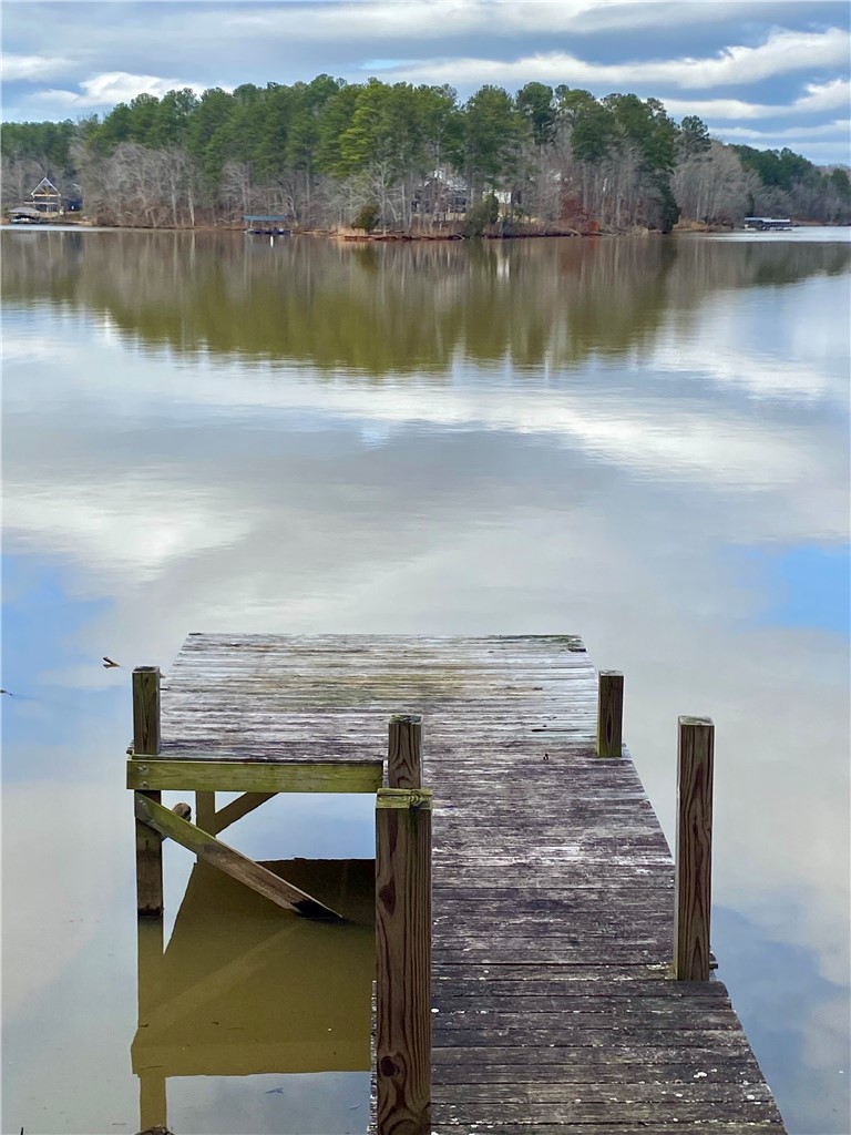 Tr6 Pierce And Amy Road Iva, SC 29655 - Photo 2 of 21 This tranquil lakefront property features a private dock with scenic views of the water and distant treeline.