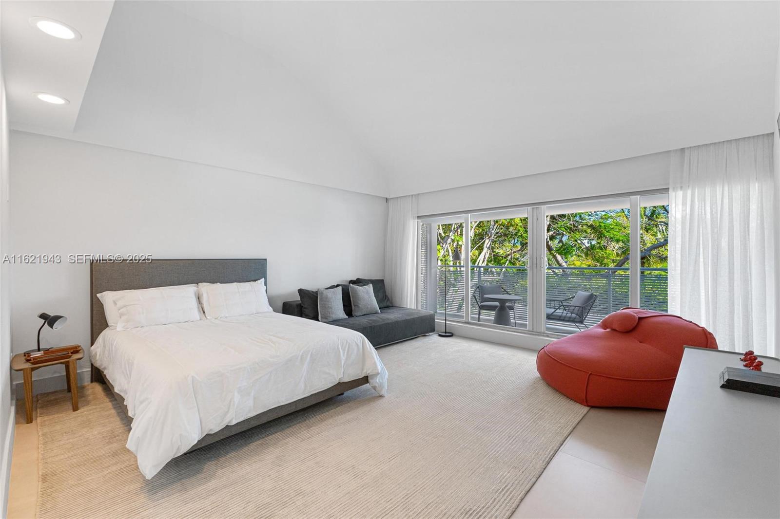 161 Cape Florida Drive Key Biscayne, FL 33149 - Photo 30 of 49 a bedroom with a bed and glass window