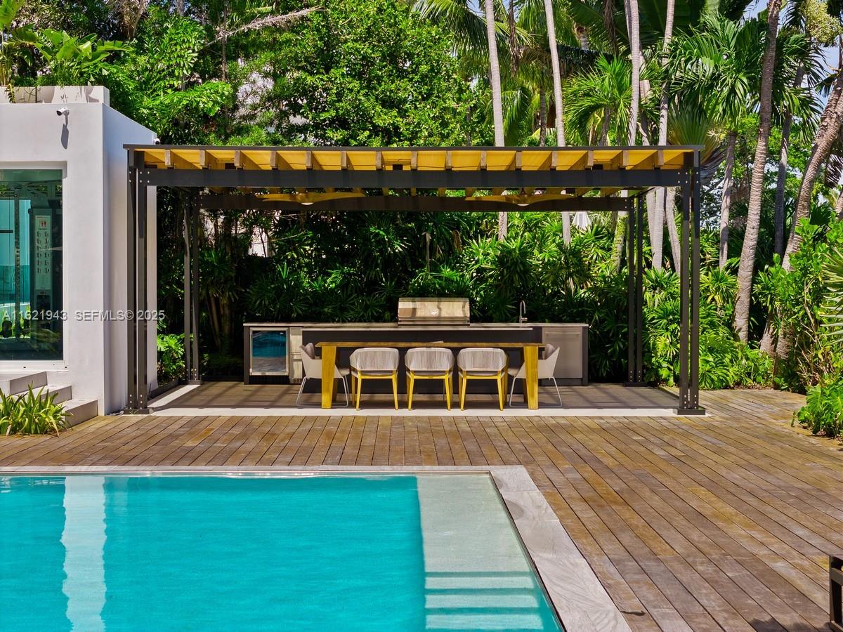 161 Cape Florida Drive Key Biscayne, FL 33149 - Photo 48 of 49 front view of a house with a patio