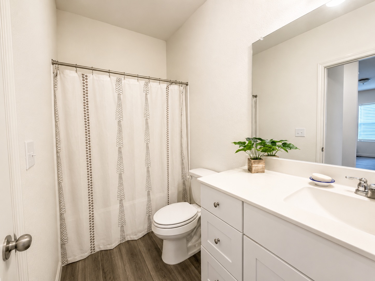 160 Light Timber Road Maxwell, TX 78656 - Photo 8 of 11 A well-appointed bathroom with a spacious vanity, sleek countertops, and rich flooring.