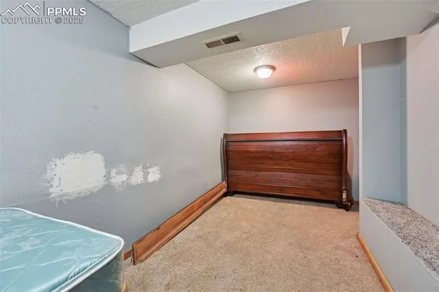 a view of room with stairs and wooden floor