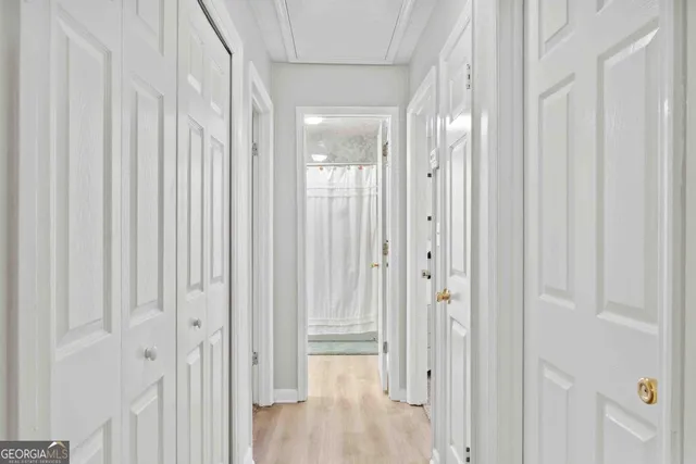 a view of a bathroom with wooden floor