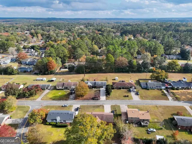 an aerial view of a houses with outdoor space