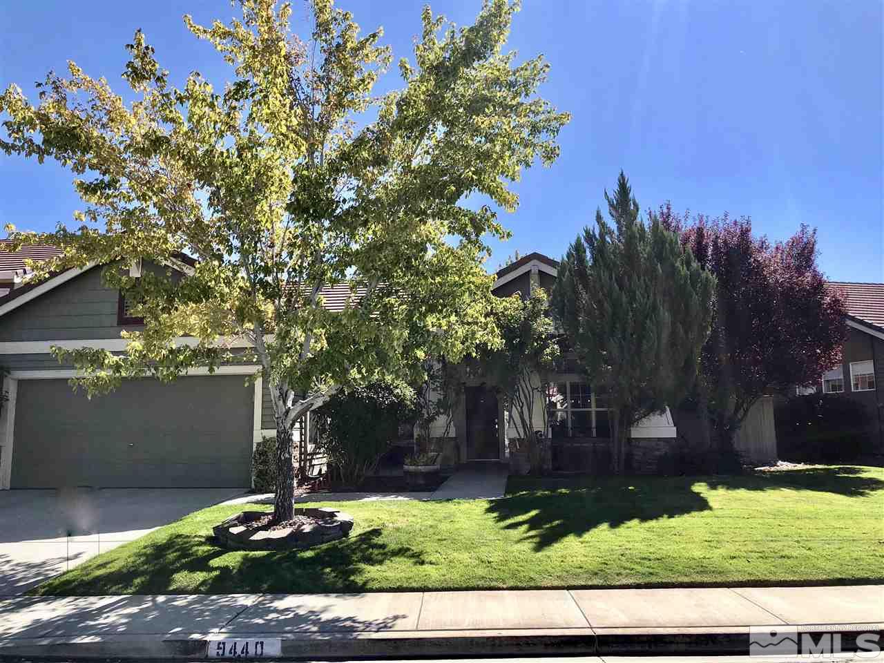 9440 Oakley Lane Reno, NV 89521 - Photo 1 of 25 front view of a house with a yard