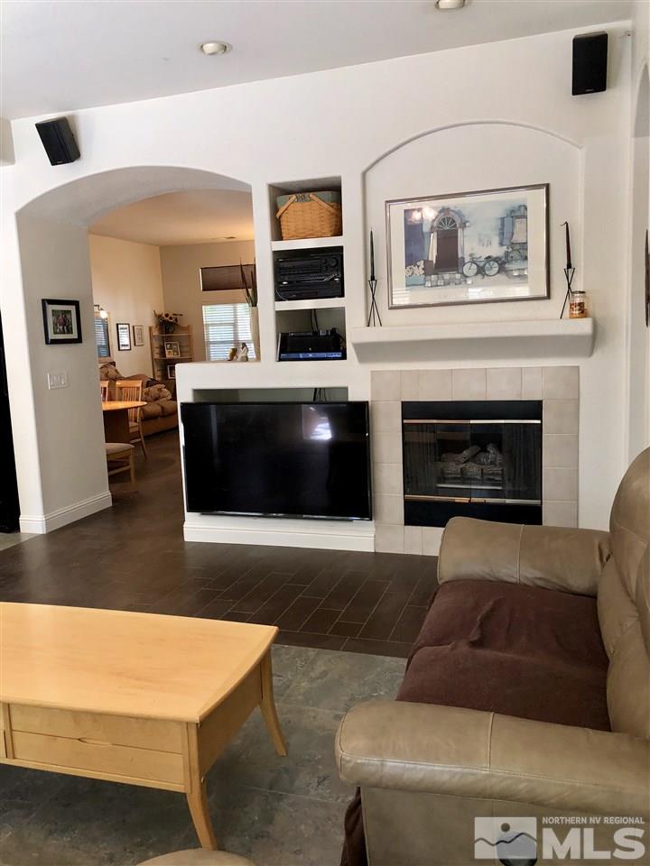 9440 Oakley Lane Reno, NV 89521 - Photo 14 of 25 a living room with furniture and a fireplace