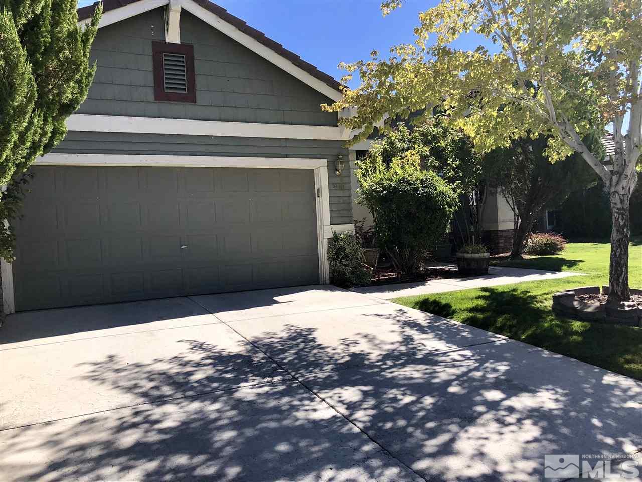 9440 Oakley Lane Reno, NV 89521 - Photo 2 of 25 a backyard of a house with lots of green space