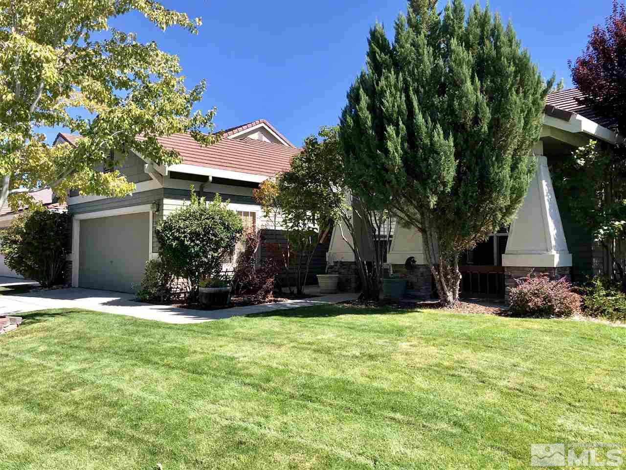 9440 Oakley Lane Reno, NV 89521 - Photo 3 of 25 a view of a house with a yard and tree