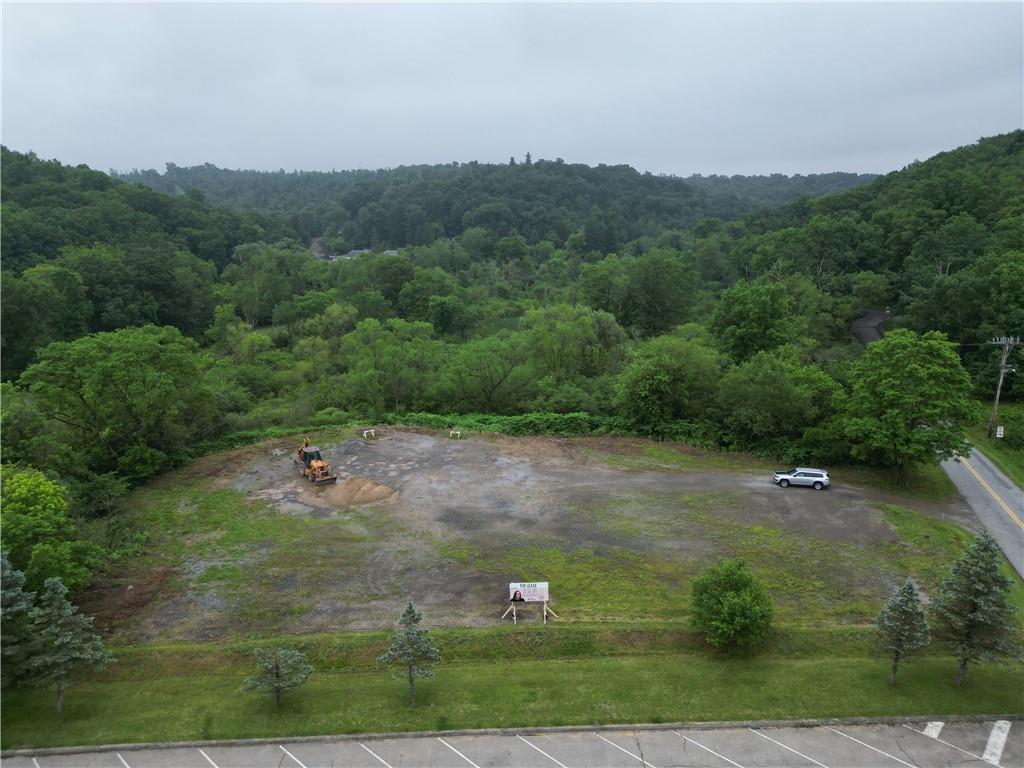 an aerial view of a house with yard