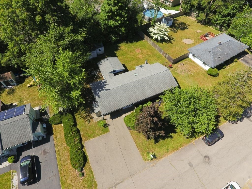 81 Errol Road Brockton, MA 02302 - Photo 4 of 31 an aerial view of a house with a swimming pool