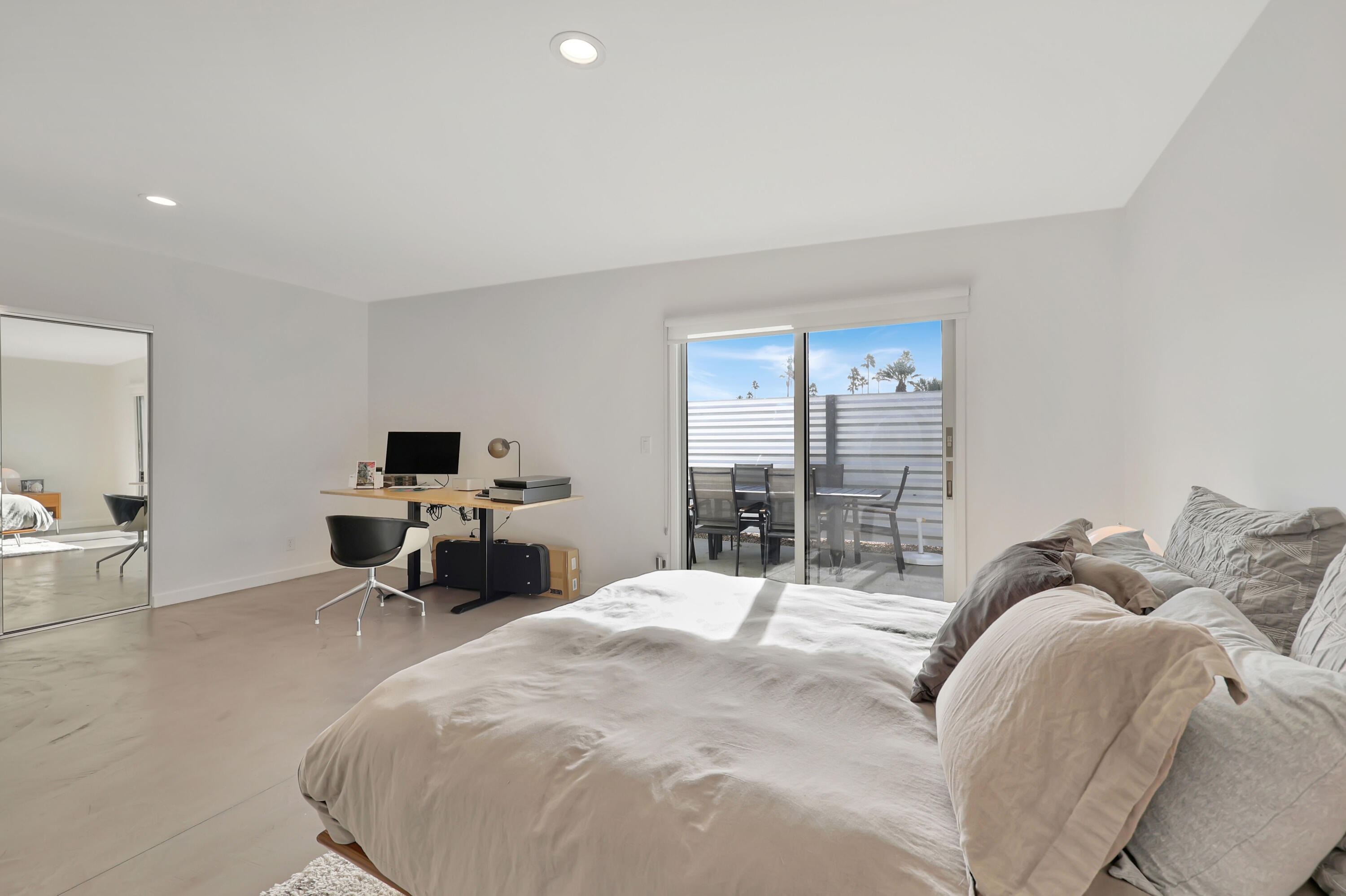 3420 East Camino Rojos Palm Springs, CA 92262 - Photo 23 of 35 a large bedroom with a bed and large window