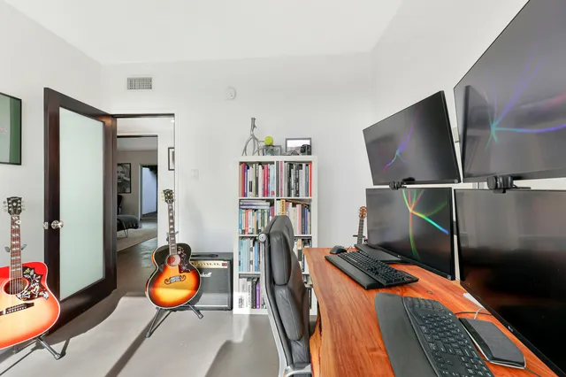 a room with furniture and gym equipment