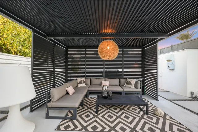 a patio with table and chairs