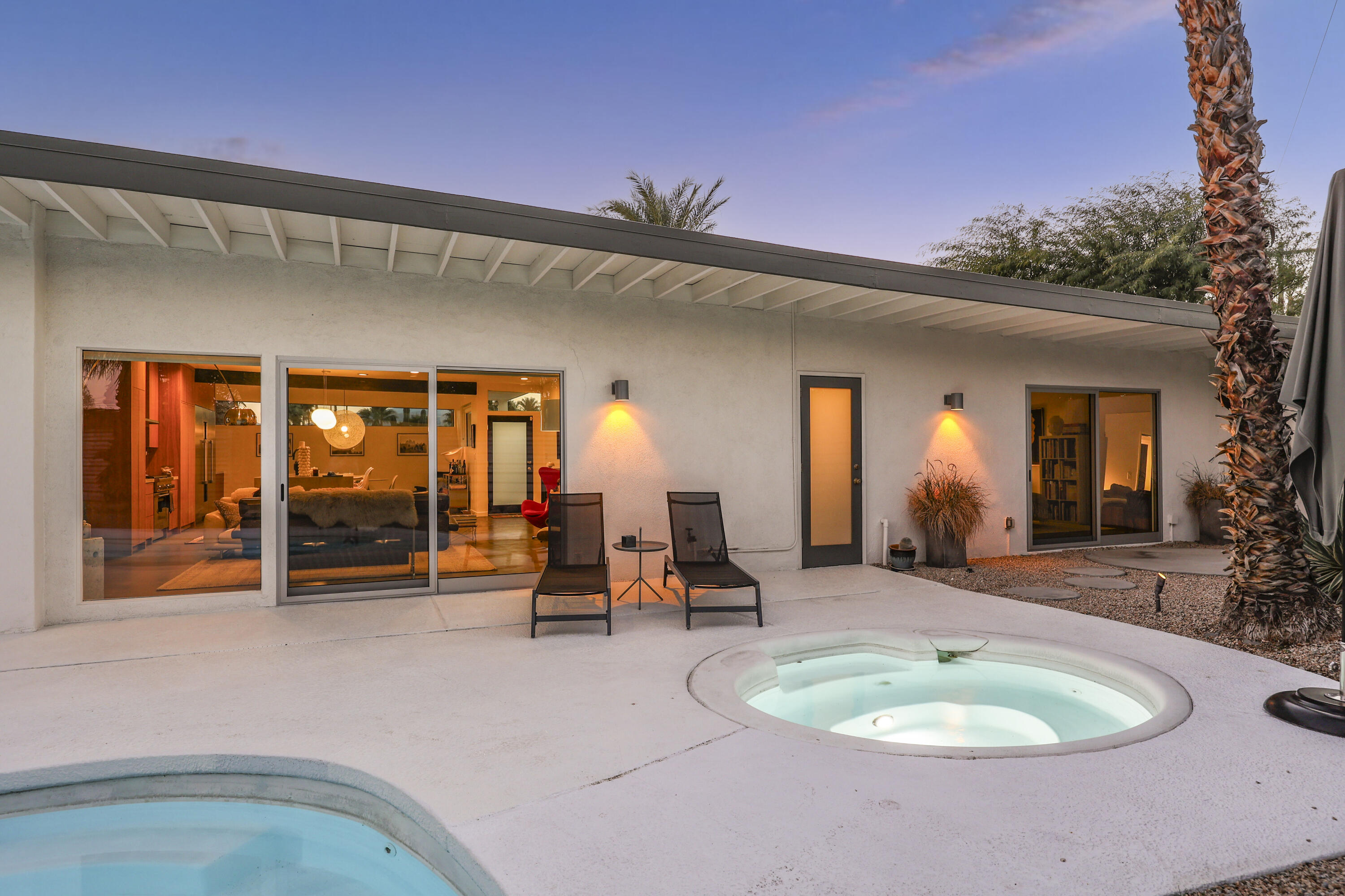 3420 East Camino Rojos Palm Springs, CA 92262 - Photo 32 of 35 a view of a chairs and tables in patio of a house