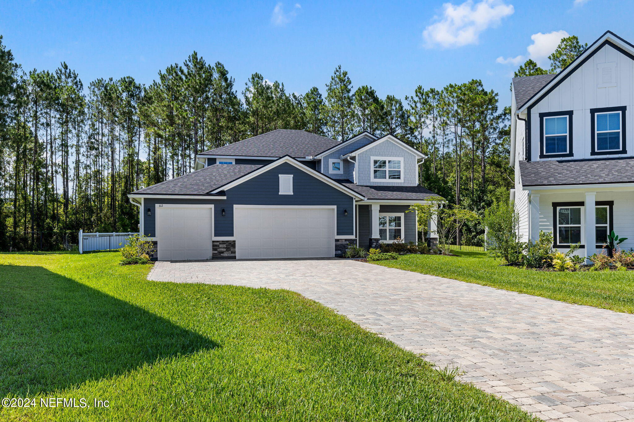 612 Watervale Drive St. Augustine, FL 32092 - Photo 2 of 28 a front view of a house with a yard and garage