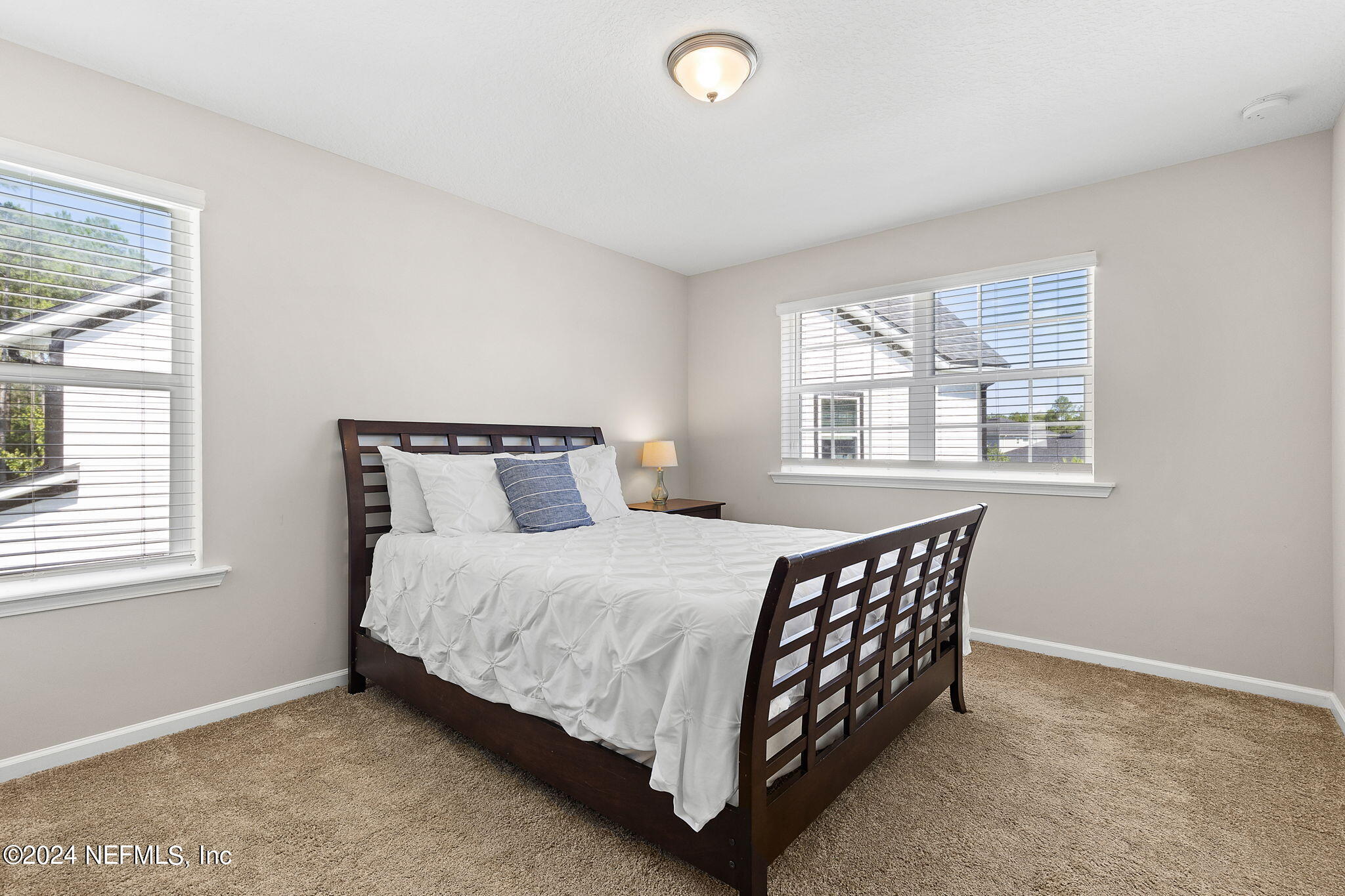 612 Watervale Drive St. Augustine, FL 32092 - Photo 24 of 28 a bedroom with a bed and window